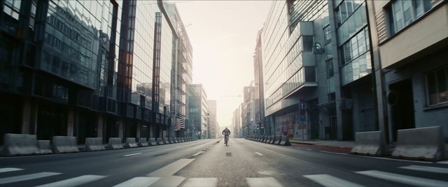 Video Reference: Building, Daytime, Infrastructure, Window, Sky, Road surface, Lighting, Neighbourhood, Urban design, Asphalt