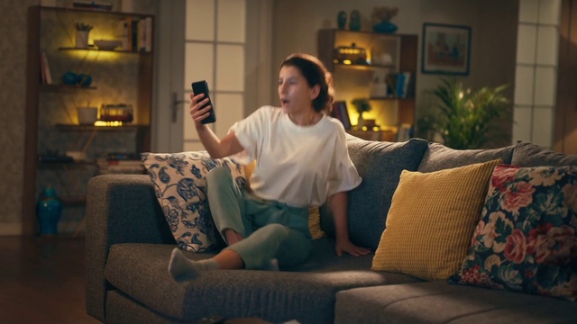 Video Reference: Hand, Arm, Plant, Couch, Comfort, Picture frame, Flash photography, Living room, Interior design, Houseplant