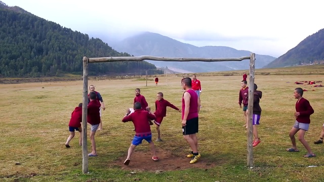 Video Reference: Sky, Shorts, Mountain, Ecoregion, People in nature, Sports equipment, Cloud, Leisure, Grass, Grassland