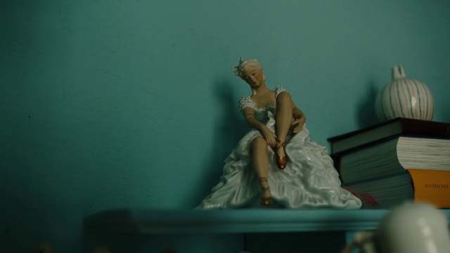 Video Reference: Toy, Sculpture, Art, Wedding dress, Statue, Gown, Formal wear, Fashion design, Bridal accessory, Event