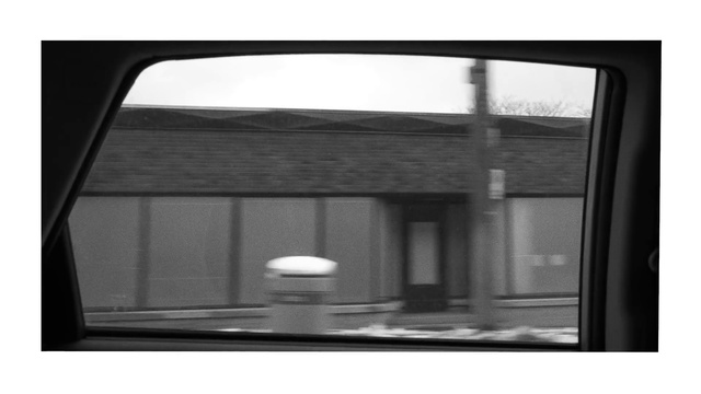 Video Reference: Rectangle, Window, Fixture, Automotive exterior, Shade, Vehicle door, Black-and-white, Tints and shades, Automotive mirror, Glass