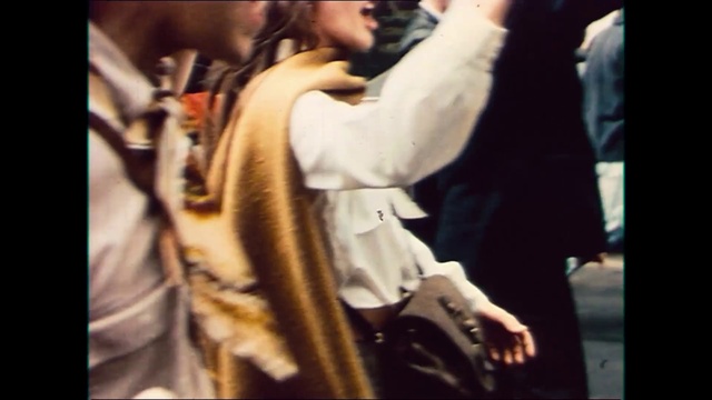 Video Reference: Gesture, Musician, Street fashion, Music, Fashion design, Event, Hat, Public transport, Formal wear, Fur