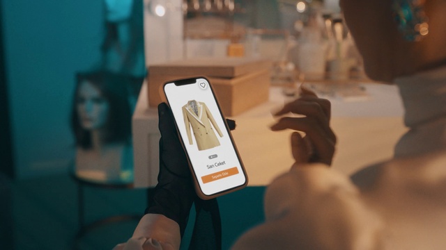 Video Reference: Gesture, Gadget, Font, Technology, Event, Electronic device, Wrist, Room, Thumb, Formal wear