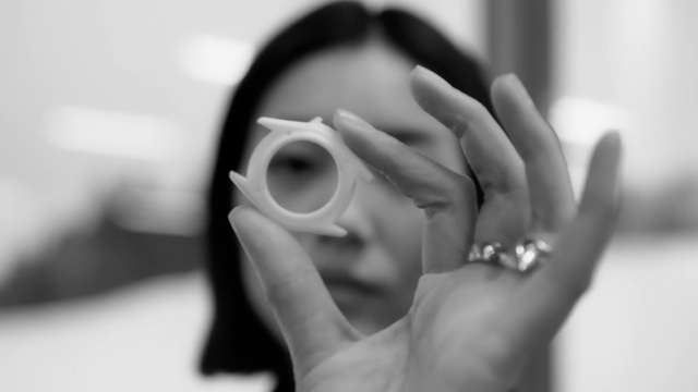 Video Reference: Head, Lip, Eyelash, Vision care, Photographer, Flash photography, Drinkware, Camera lens, Gesture, Eyewear