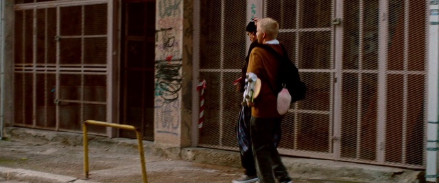 Video Reference: Temple, Musician, Sidewalk, Road surface, Flooring, Urban area, City, Facade, Human settlement, Pedestrian