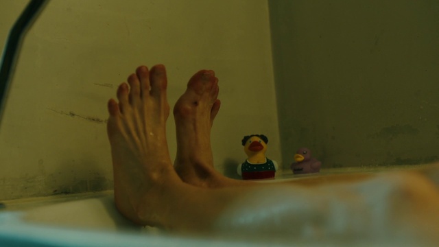 Video Reference: Gesture, Finger, Bathing, Barefoot, Foot, Toy, Leisure, Toe, Plumbing, Recreation