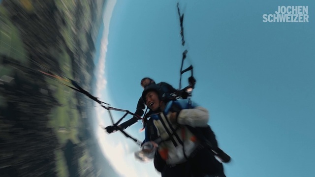 Video Reference: Sky, Parachuting, Windsports, Wind, Recreation, Helmet, Paragliding, Air sports, Rope, Electric blue