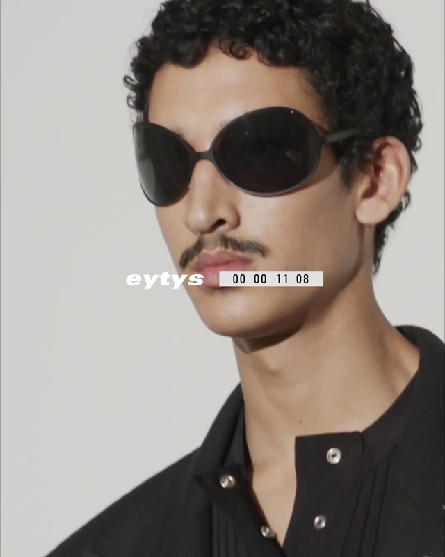 Video Reference: Hair, Forehead, Glasses, Nose, Head, Lip, Chin, Outerwear, Hairstyle, Eyebrow