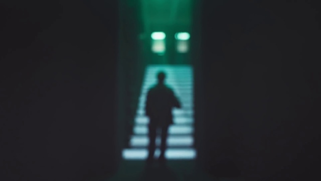 Video Reference: Tints and shades, Electric blue, Font, Display device, Darkness, Event, Symmetry, Backlighting, Shadow, Pedestrian