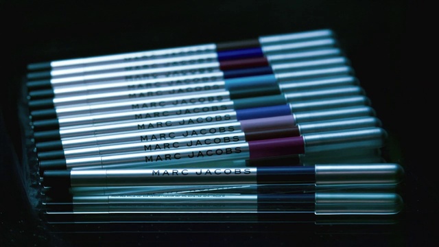 Video Reference: Writing implement, Rectangle, Office supplies, Cosmetics, Font, Tints and shades, Stationery, Electronic device, Electric blue, Magenta