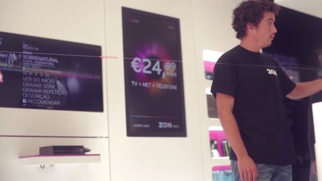 Video Reference: Font, Magenta, T-shirt, Gadget, Event, Electronic device, Display device, Multimedia, Advertising, Job