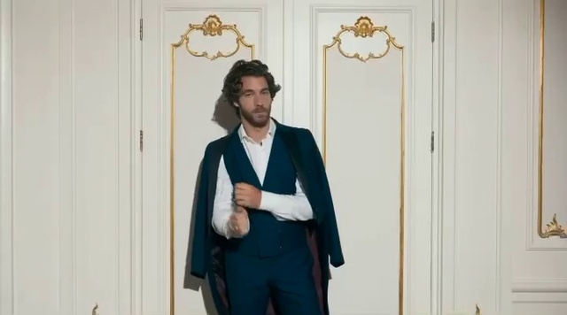 Video Reference: Dress shirt, Sleeve, Beard, Standing, Gesture, Collar, Street fashion, Happy, Blazer, Formal wear