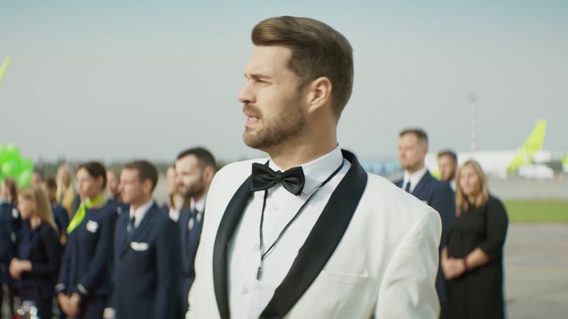 Video Reference: Beard, Dress shirt, Bow tie, Sleeve, Gesture, Collar, Street fashion, Eyewear, Tie, Blazer