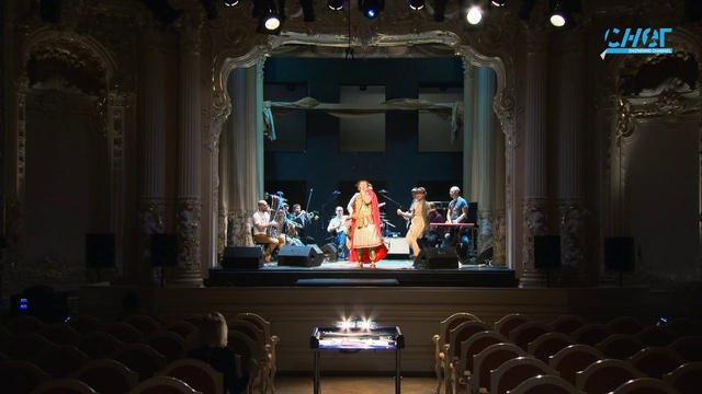 Video Reference: Musical instrument, Chair, Entertainment, Performing arts, Musical instrument accessory, Music, Curtain, Building, Stage, Event