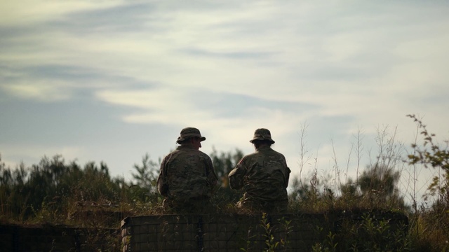 Video Reference: Cloud, Sky, Plant, Military camouflage, People in nature, Marines, Cap, Military uniform, Military person, Gesture