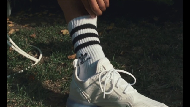 Video Reference: Footwear, Joint, Leg, Knee, Grass, Walking shoe, Sock, People in nature, Thigh, Calf