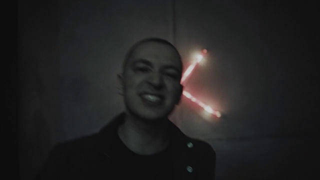 Video Reference: Smile, Flash photography, Jaw, Gesture, Audio equipment, Midnight, Facial hair, Space, Automotive lighting, Event