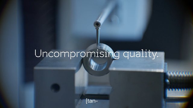Video Reference: precision, measurement, metal part, machining, industrial, quality control, inspection, vise, close-up, engineering, manufacturing, equipment, metalwork, calibration, text overlay