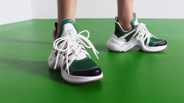 Video Reference: Footwear, Shoe, White, Green, Sports equipment, Walking shoe, Sportswear, Sneakers, Red, Grass