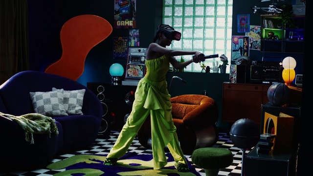 Video Reference: Hat, Fun, Entertainment, Chair, Event, Audio equipment, Games, Room, Fashion design, Fictional character