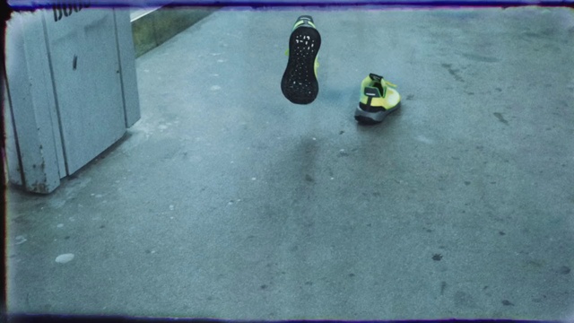 Video Reference: Shoe, Blue, Road surface, Asphalt, Grey, Flooring, Floor, Tints and shades, Sidewalk, Grass