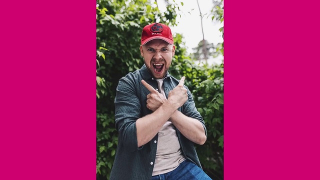 Video Reference: Clothing, Smile, Cap, Flash photography, Sleeve, Standing, Happy, Gesture, Street fashion, Pink