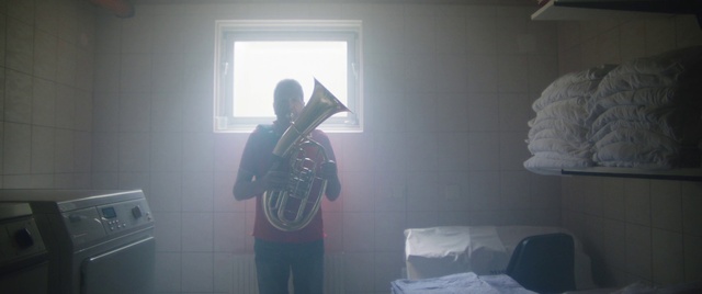 Video Reference: Musical instrument, Window, Musician, Wall, T-shirt, Hat, Wind instrument, House, Music, Entertainment