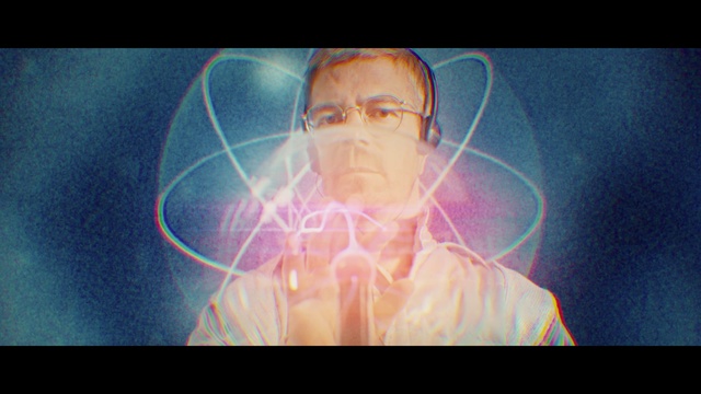Video Reference: Head, Jaw, Flash photography, Art, Organism, Font, Fun, Visual effect lighting, Electric blue, Lens flare