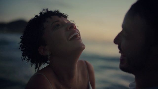 Video Reference: Cloud, Water, Sky, Flash photography, Jaw, Neck, Happy, Gesture, Sunlight, Dusk