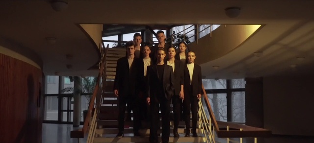 Video Reference: Smile, Suit, Formal wear, Event, Window, Fashion design, Fun, White-collar worker, Team, Tourist attraction