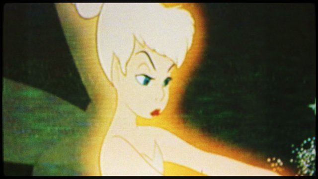 Video Reference: animated, fairy, blonde hair, close-up, fantasy, character, glowing, cartoon, magic, dark background