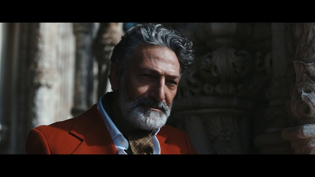 Video Reference: Jaw, Flash photography, Beard, Collar, Wrinkle, Blazer, Dress shirt, Facial hair, Moustache, Formal wear