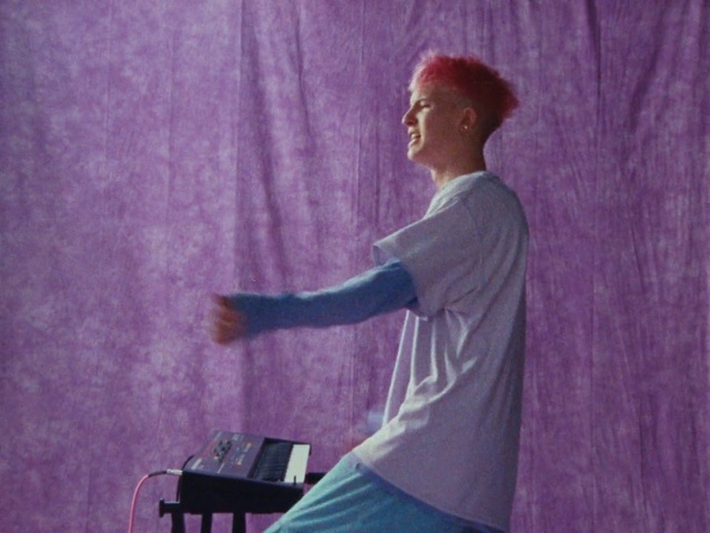 Video Reference: Purple, Audio equipment, Music, T-shirt, Computer, Entertainment, Performing arts, Laptop, Event, Elbow