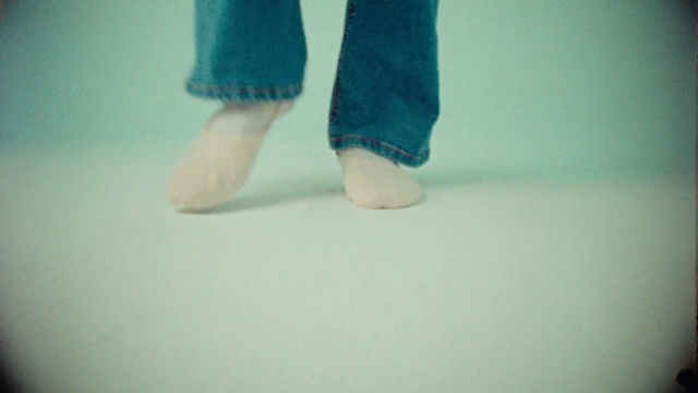 Video Reference: Azure, Blue, Human body, Knee, Gesture, Aqua, Flooring, Floor, Foot, Barefoot