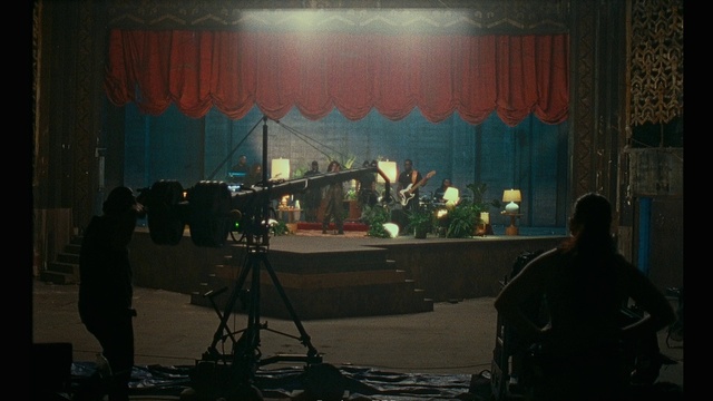 Video Reference: Musician, Tripod, Music, Entertainment, Curtain, Musical instrument accessory, Videographer, Performing arts, Music venue, Film crew