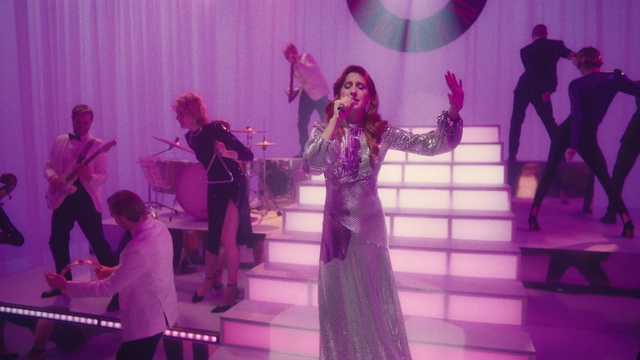 Video Reference: Microphone, Purple, Musician, Dress, Entertainment, Fashion, Music artist, Lighting, Concert, Music