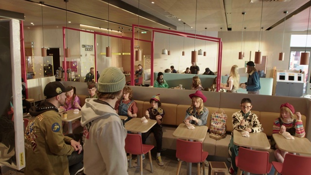 Video Reference: Interior design, Hat, Social group, Chair, Jacket, Table, Crowd, Event, Suit, Leisure