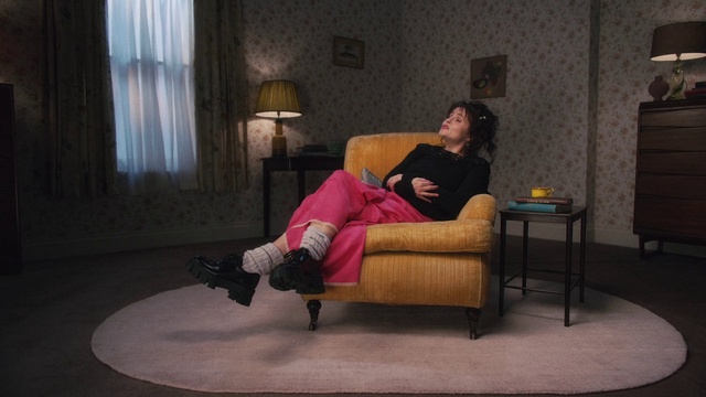 Video Reference: Furniture, Comfort, Couch, Purple, Flash photography, Table, Interior design, studio couch, Curtain, Knee