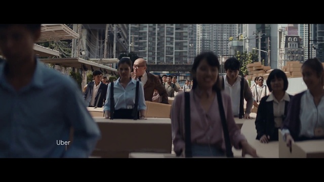 Video Reference: Coat, Building, Gesture, Street fashion, White-collar worker, Event, City, Crowd, Formal wear, Fun