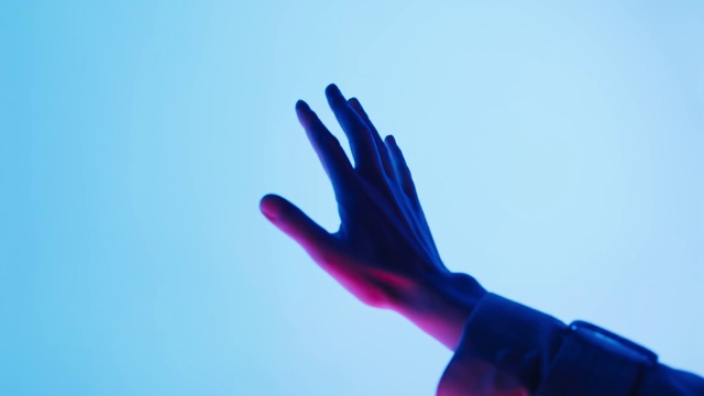 Video Reference: Sky, Human body, Gesture, Glove, Thumb, Wrist, Tints and shades, Nail, Electric blue, Sign language