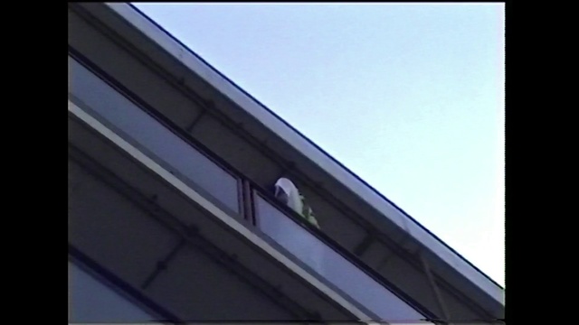 Video Reference: Sky, Rectangle, Building, Tints and shades, Font, Electric blue, Automotive exterior, Facade, Composite material, Metal