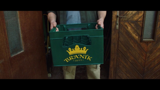 Video Reference: Sleeve, Wood, Drink, Font, Wrist, Wood stain, Hardwood, Motor vehicle, T-shirt, Flooring