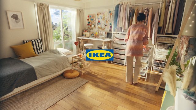 Video Reference: bedroom, dressing room, interior, home decor, wardrobe, clothing rack, storage drawers, desk, window, wood floor, person, organized, sunlit, furniture, IKEA logo, lifestyle