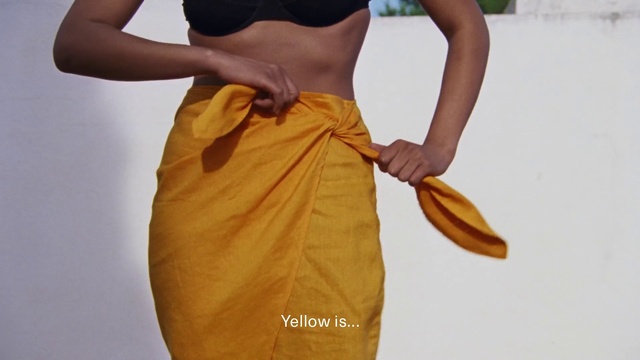 Video Reference: Orange, Sleeve, Waist, Gesture, Knee, Thigh, Shorts, Sleeveless shirt, Elbow, Trunk