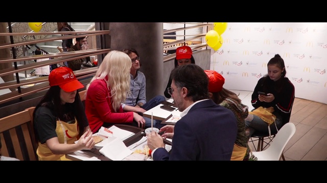 Video Reference: Hat, Jacket, Automotive design, Chair, Eyewear, Cap, T-shirt, Baseball cap, Event, Suit