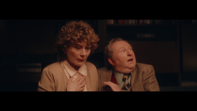 Video Reference: Chin, Coat, Flash photography, Gesture, Entertainment, Suit, Performing arts, Tie, Event, Formal wear