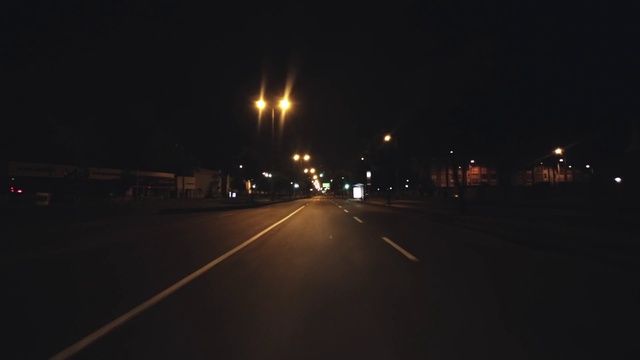 Video Reference: Brown, Automotive lighting, Street light, Road surface, Asphalt, Electricity, Amber, Thoroughfare, Sky, Road