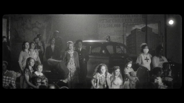 Video Reference: Car, Motor vehicle, Vehicle, Style, Automotive lighting, Event, Monochrome photography, Monochrome, Vintage clothing, Darkness