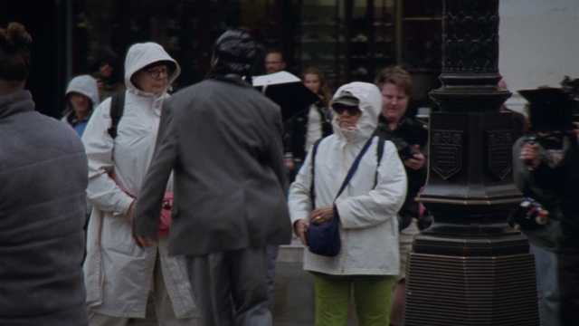 Video Reference: Headgear, Event, City, Pedestrian, Uniform, Hat, Street, Walking, Tradition, Crowd