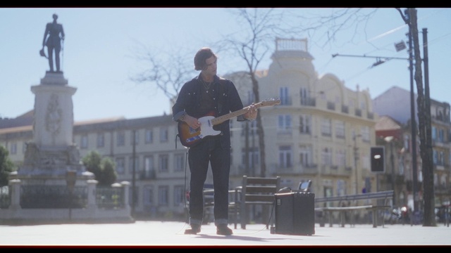 Video Reference: Sky, Building, Guitar, Musical instrument, Guitar accessory, Tree, Musician, Music, String instrument, String instrument